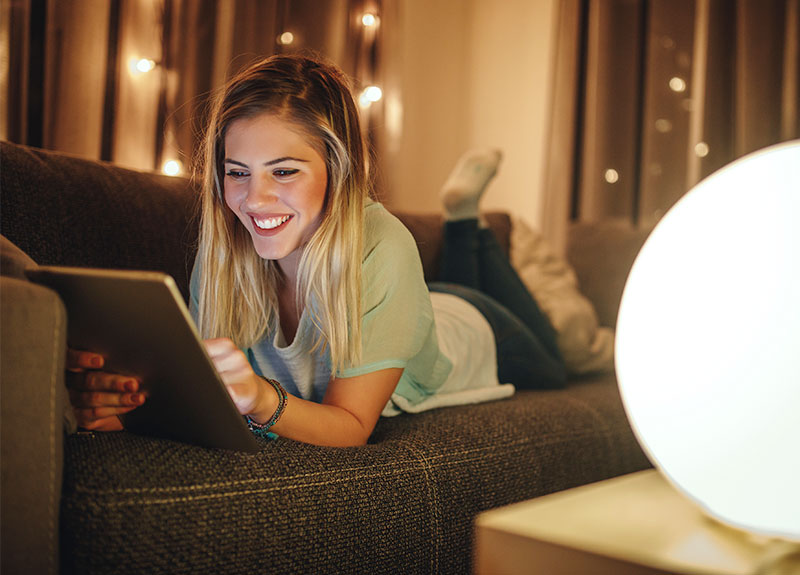 Woman Browsing Loans At Atomic Mortgages