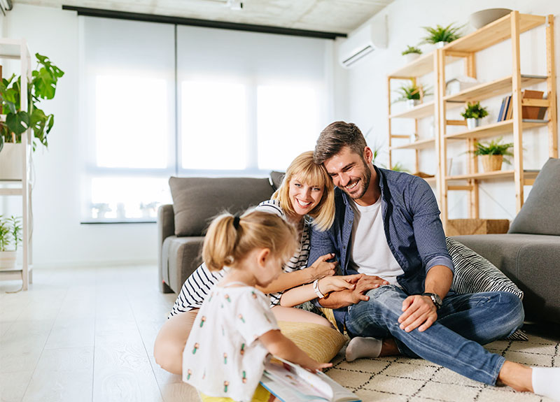 Happy Family In Their New Home