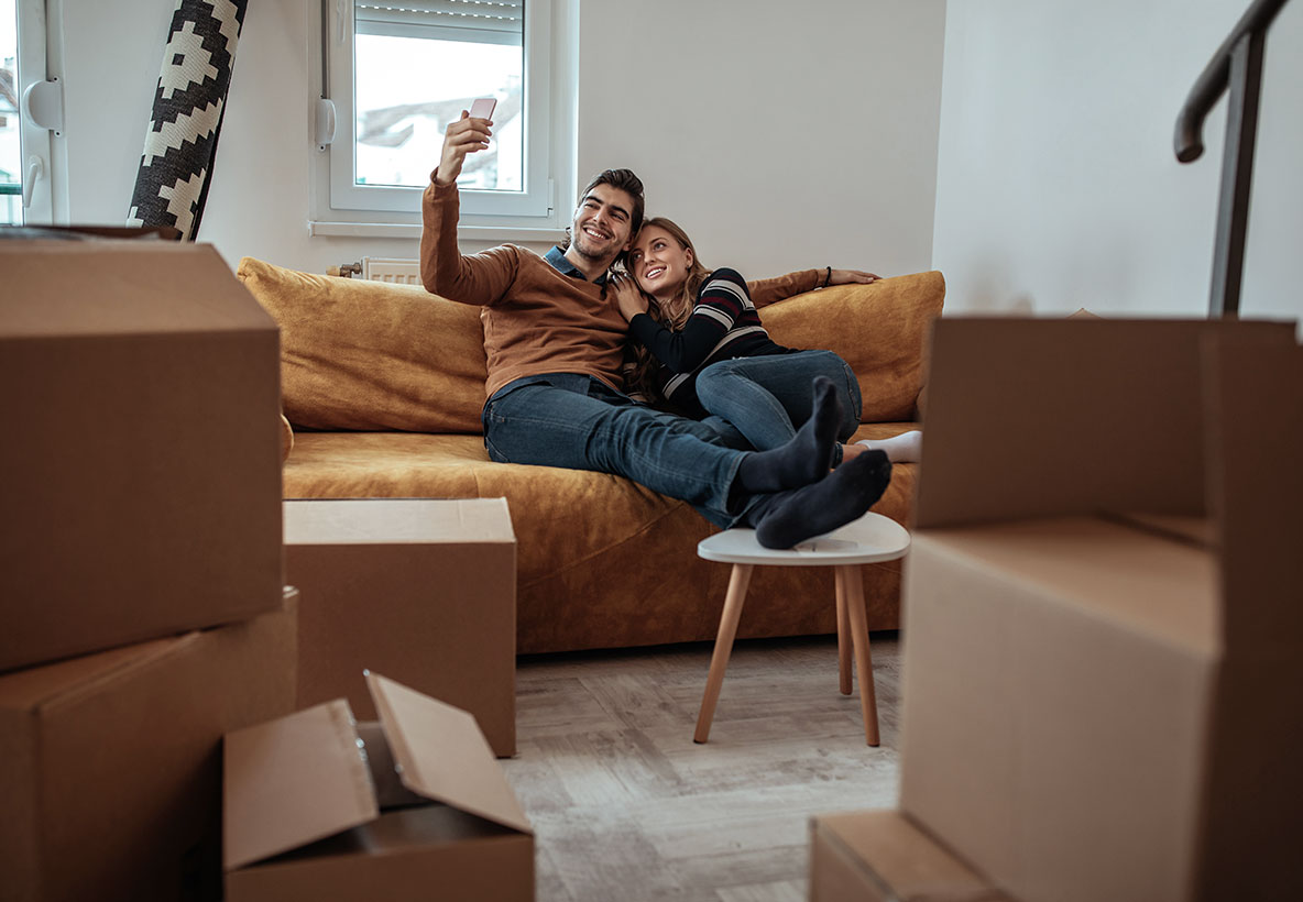 Laughing Couple With New Home