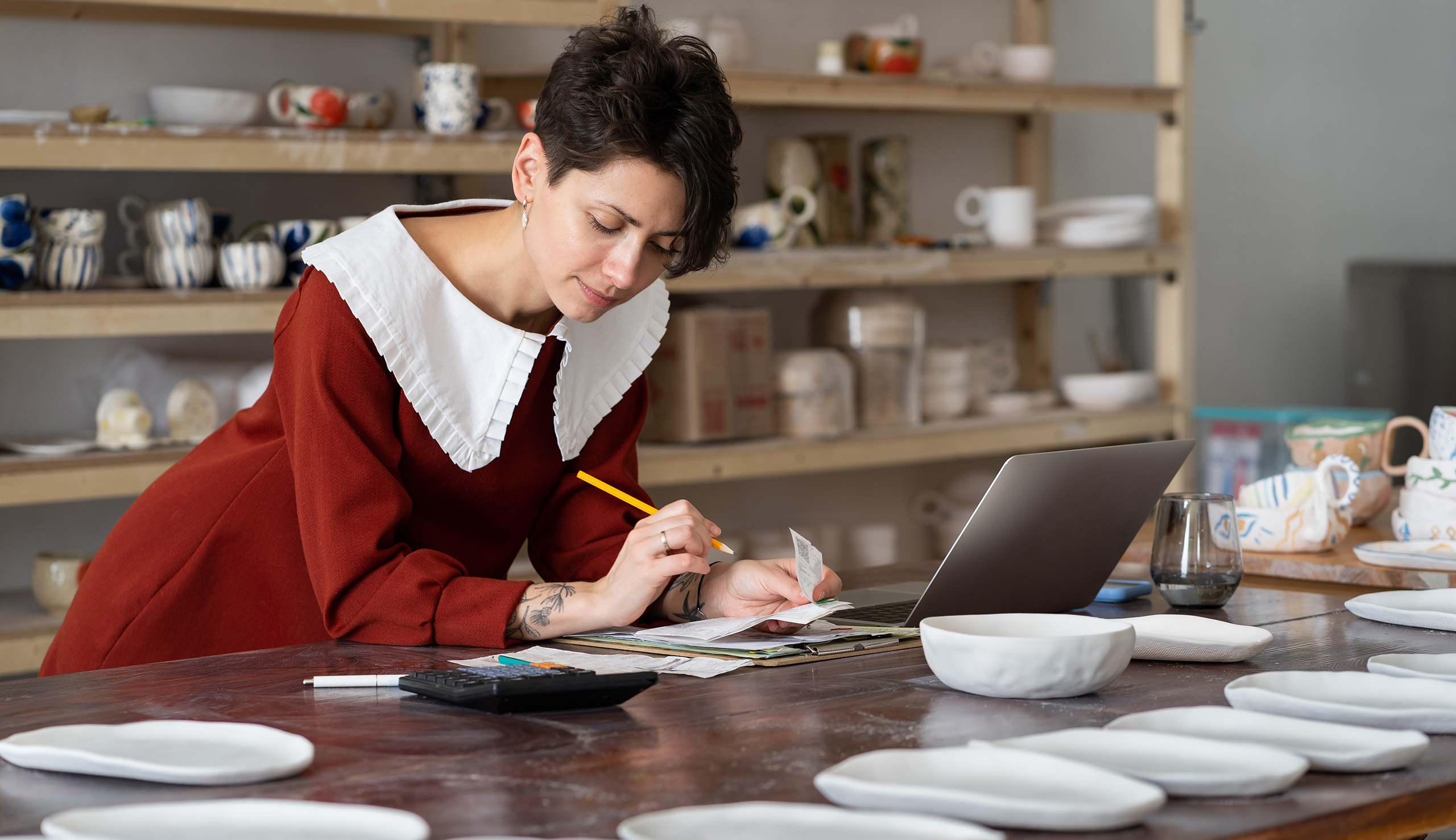Lady In A Pottery Shop Calculating